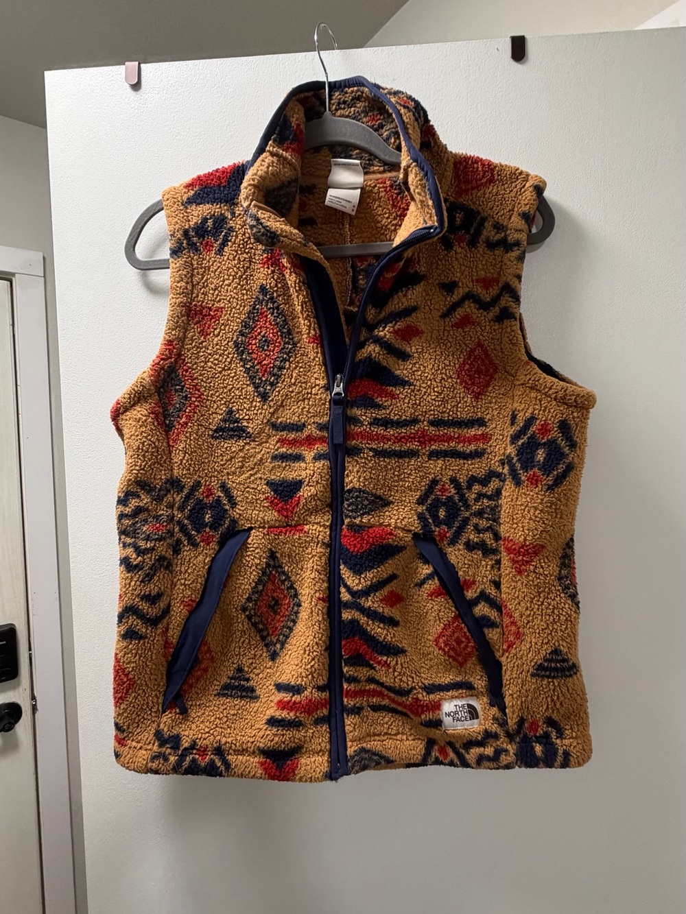 The North Face Tan Sherpa Vest with Navy & Red Pattern